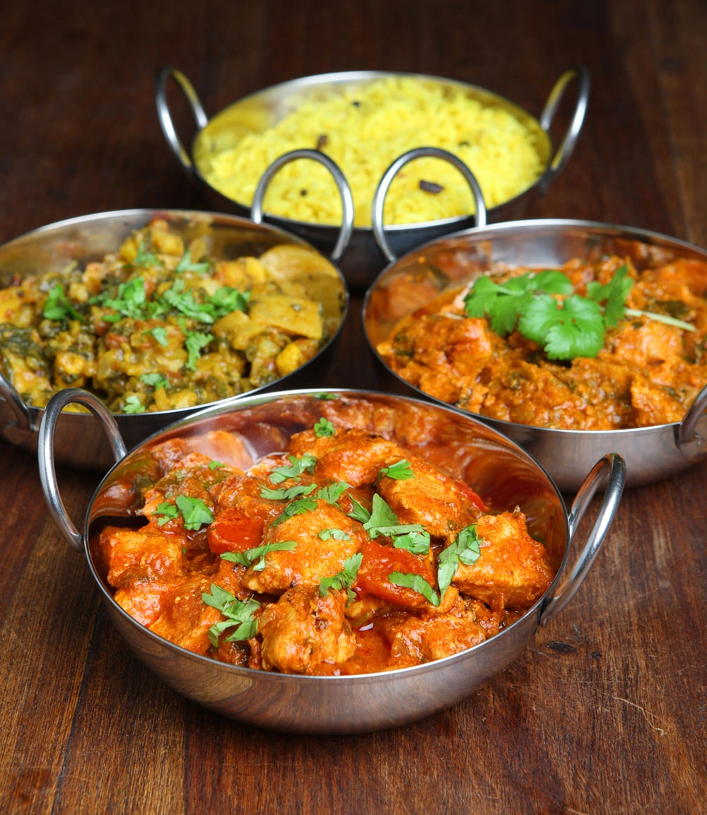 Selection of Indian curries with pilau rice at Ginger Indian Cuisine, Richmond BC